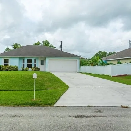 Buy this 3 bed house on 1684 Southwest Glacador Avenue in Port Saint Lucie, FL 34953