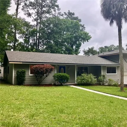 Buy this 5 bed house on 6678 Northwest 24th Place in Alachua County, FL 32606