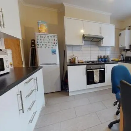 Rent this 4 bed townhouse on Spring Grove Walk in Leeds, LS6 1RR