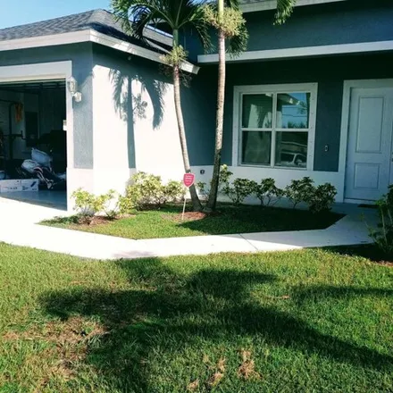 Buy this 4 bed house on 560 Southwest Whitmore Drive in Port Saint Lucie, FL 34984