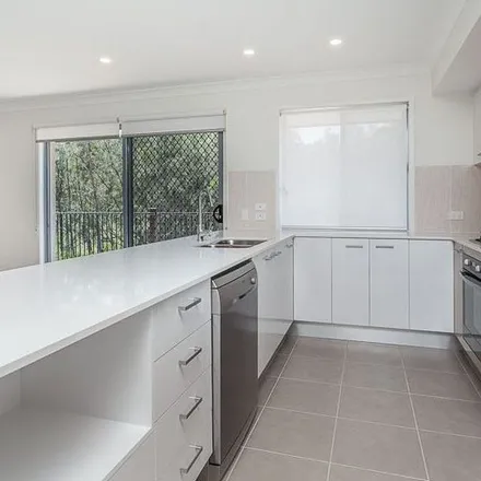 Rent this 4 bed apartment on 42 Tree Ring Circuit in Mango Hill QLD 4509, Australia