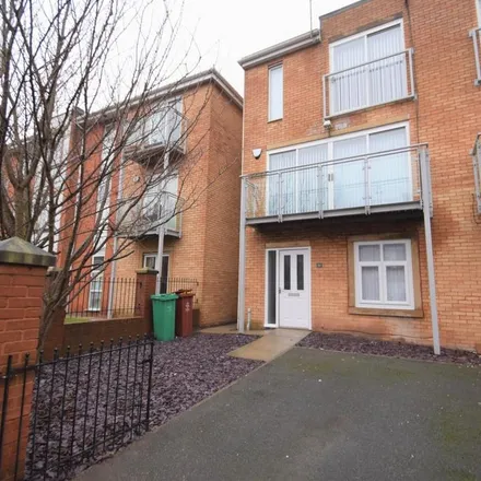 Rent this 4 bed townhouse on 54 Chevassut Street in Manchester, M15 5LR