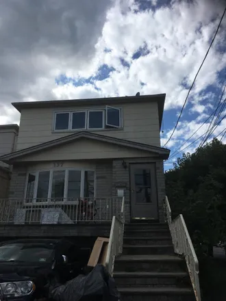 Rent this 3 bed townhouse on 137 Hobart Avenue in Port Johnson, Bayonne