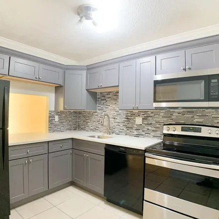 Rent this 2 bed apartment on Sands Point Boulevard in Tamarac, FL 33321