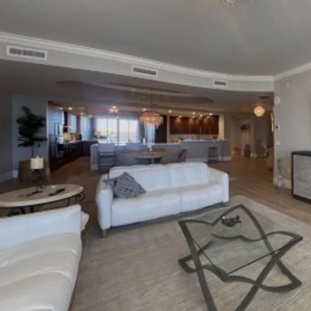 Rent this 3 bed apartment on #502,13665 Vanderbilt Drive in Aqua at Pelican Isle Yacht Club Condominiums, Naples
