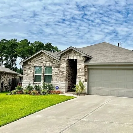 Rent this 4 bed house on Gingerland Drive in Conroe, TX 77387