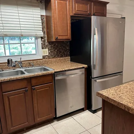 Rent this 3 bed apartment on 854 Gibson Street in Titusville, FL 32780