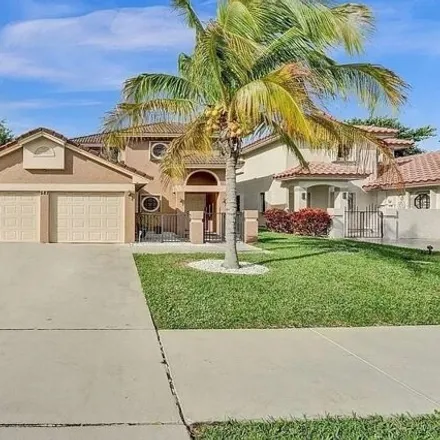 Rent this 3 bed house on 583 Northwest 38th Avenue in The Lakes of Deer Creek, Deerfield Beach