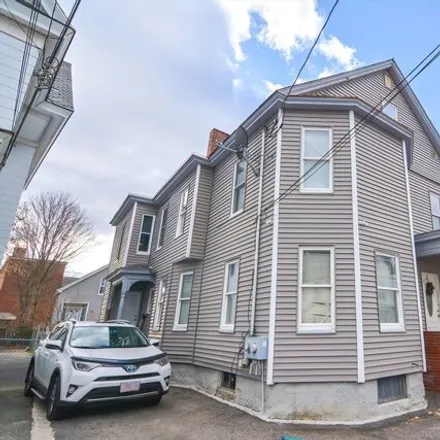 Buy this 6 bed townhouse on 65 Fort Hill Avenue in Belvidere, Lowell