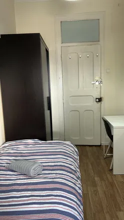 Rent this 5 bed room on Rua Eduardo Brazão in 1900-287 Lisbon, Portugal