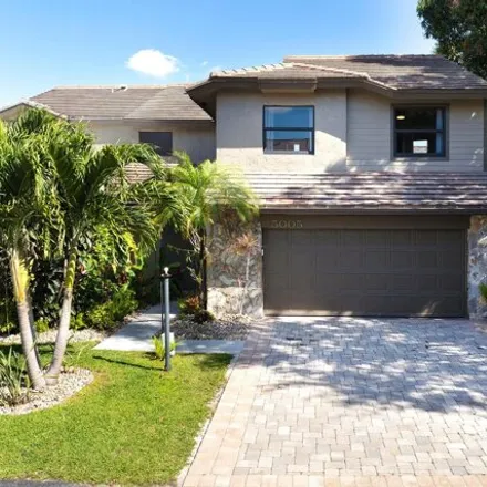 Buy this 4 bed house on Shady Lakes Drive in Palm Beach Gardens, FL 33418