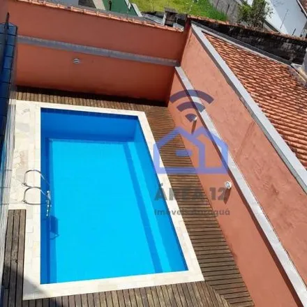 Buy this 2 bed apartment on Rua Bartolomeu Bueno da Silva in Martin de Sá, Caraguatatuba - SP