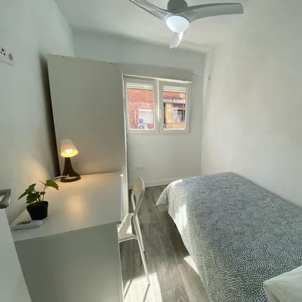 Rent this 4 bed room on Calle de Encarnación Oviol in 28021 Madrid, Spain