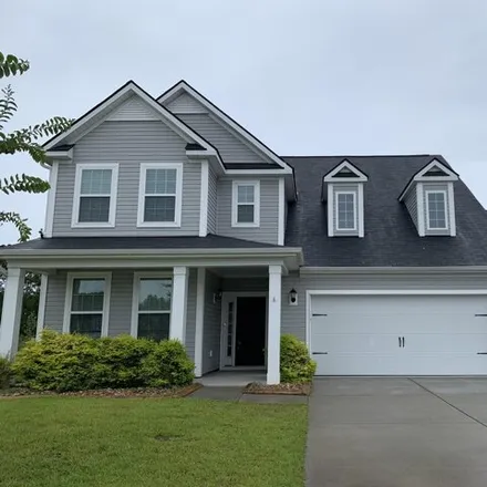 Rent this 4 bed house on 299 Bigleaf Court in Cane Bay Plantation, SC 29486