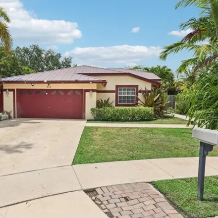 Buy this 4 bed house on 117 Churchill Dr in Royal Palm Beach, Florida