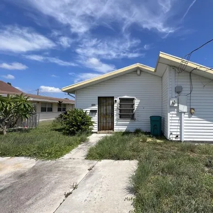 Buy this 3 bed house on 413 Martin Luther King Jr Boulevard in Boynton Beach, FL 33435