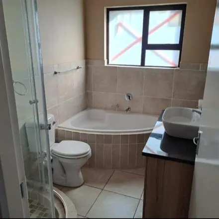 Rent this 3 bed townhouse on Chris Kotze Street in Vorsterpark AH, Midvaal Local Municipality