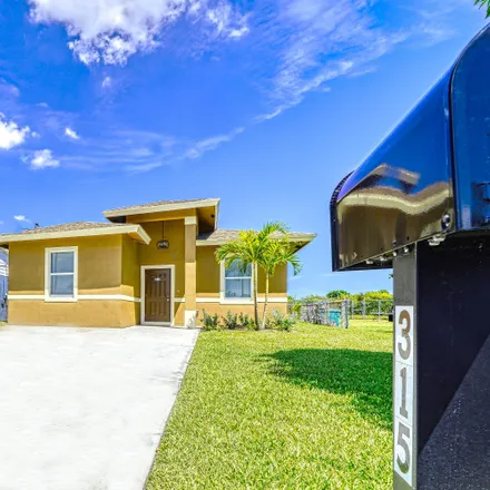 Rent this 4 bed house on 315 Northeast 13th Avenue in Boynton Beach, FL 33435