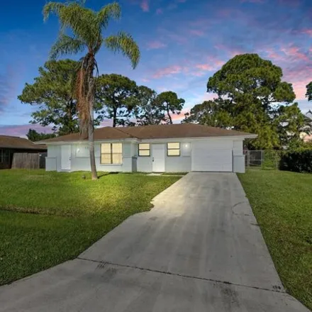 Rent this 3 bed house on 1259 Southwest Sudder Avenue in Port Saint Lucie, FL 34953