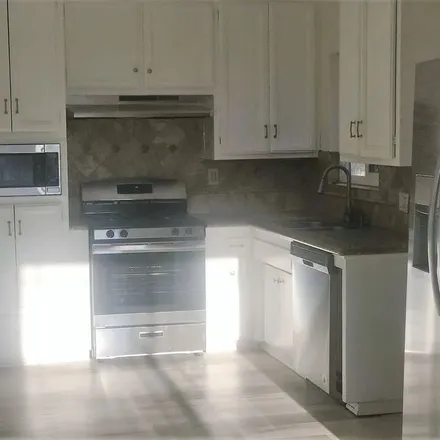 Rent this 4 bed apartment on 1462 Butler Avenue in Los Angeles, CA 90025