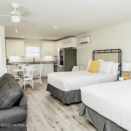 Rent this studio condo on SaltWater Suites in 605 North Topsail Drive, Surf City