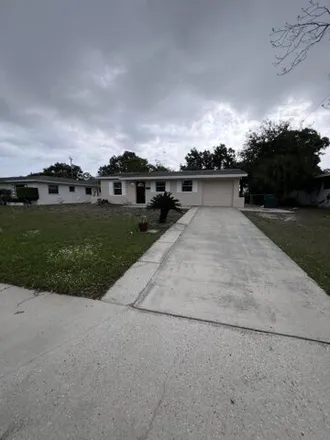 Rent this 3 bed house on 867 Tupelo Drive in Melbourne, FL 32935