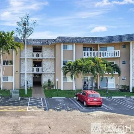 Rent this 2 bed apartment on 7430 Miami Lakes Dr