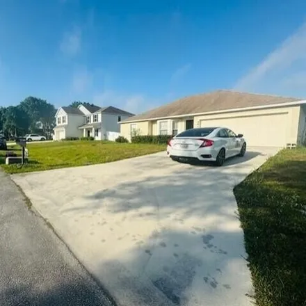 Buy this 3 bed house on 4622 Southwest Carib Street in Port Saint Lucie, FL 34953