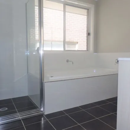 Rent this 4 bed apartment on 105 Bluestone Drive in Glenmore Park NSW 2745, Australia