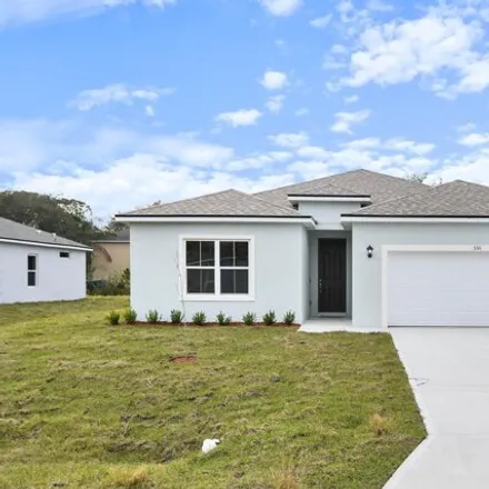 Buy this 4 bed house on 377 Cavern Avenue Southeast in Palm Bay, FL 32909