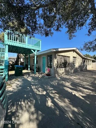 Rent this 4 bed house on 603 Dolphin St in Panama City Beach, Florida