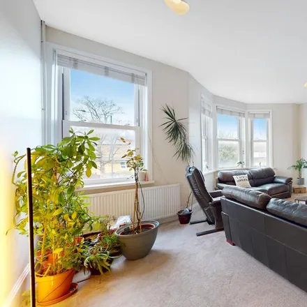 Rent this 3 bed house on Lloyd's Groceries in 104 Craven Park, London