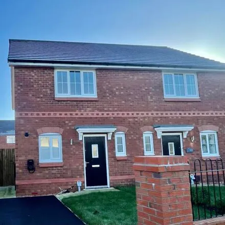 Rent this 2 bed duplex on Kirkmanshulme Lane in Manchester, M12 4TP