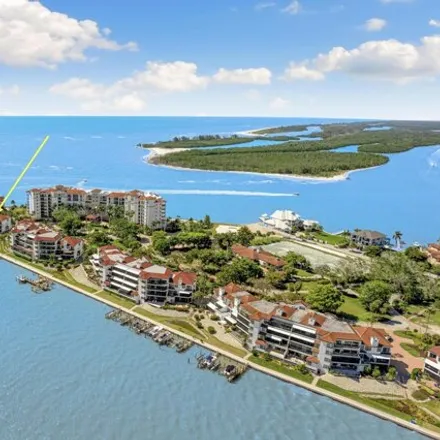 Buy this 2 bed townhouse on Twin Dolphins in La Peninsula Boulevard, Collier County