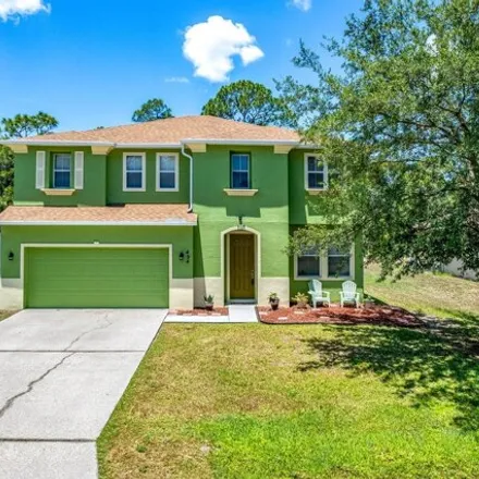 Buy this 4 bed house on 490 Avocado Road Northwest in Palm Bay, FL 32907