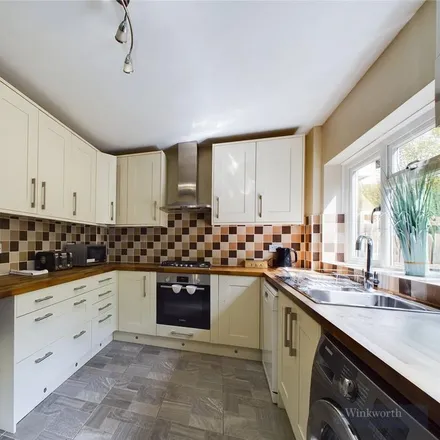 Rent this 3 bed townhouse on Rollesby Road in London, KT9 2BZ