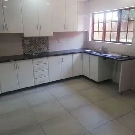 Rent this 4 bed apartment on Louw Avenue in Lakefield, Benoni