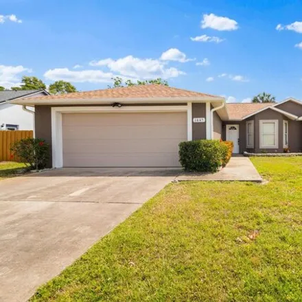 Buy this 3 bed house on 1651 Sweetwood Drive in Melbourne, FL 32935