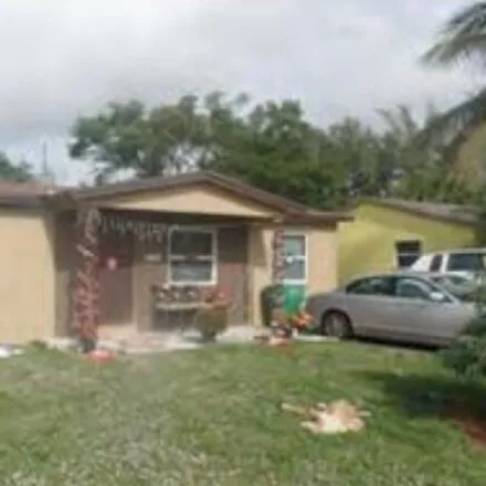 Rent this 3 bed house on 1524 West 9th Street in Riviera Beach, FL 33404