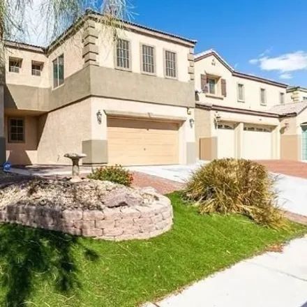 Rent this 4 bed house on 1428 Crystal Rainey Avenue in North Las Vegas, NV 89086