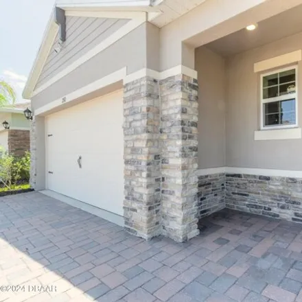 Buy this 3 bed house on 292 Caryota Court in South Village, New Smyrna Beach