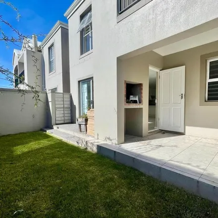 Rent this 3 bed townhouse on Woodlands Close in Tara, Western Cape