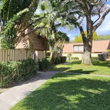 Rent this 2 bed townhouse on Kingston Court in West Palm Beach, FL 33409