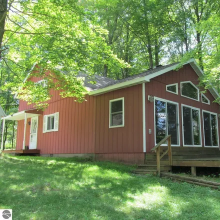 Buy this 3 bed house on 14302 Wildwood Road in Hartwick Township, MI 49631