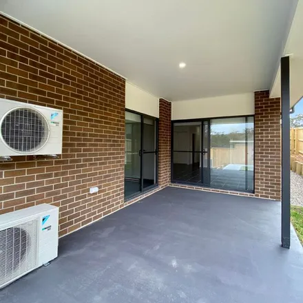 Rent this 3 bed apartment on Wonnai Street in Fletcher NSW 2287, Australia