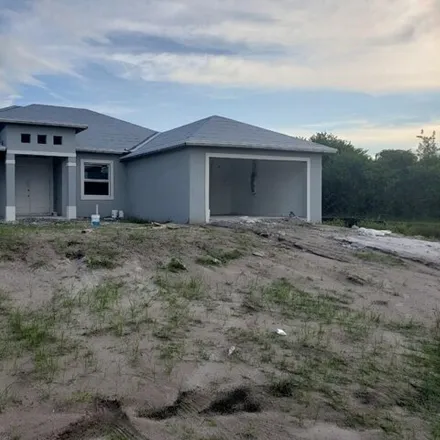 Buy this 4 bed house on 3199 35th Street Southwest in Lehigh Acres, FL 33976