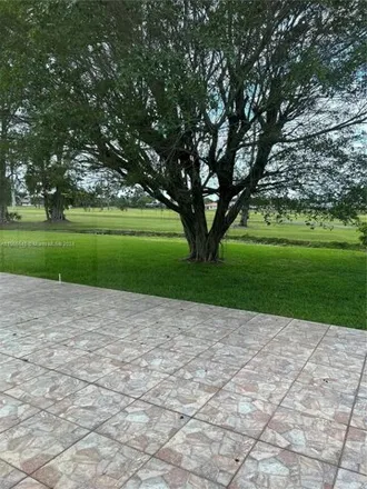 Rent this 7 bed house on 19740 West Saint Andrews Drive in Country Club, Hialeah