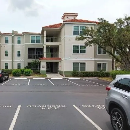 Buy this 3 bed condo on Walden Center Drive in Mirasol at Coconut Point, Lee County