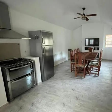 Rent this 3 bed house on Axion in Camino Parque Centenario 785, Partido de La Plata