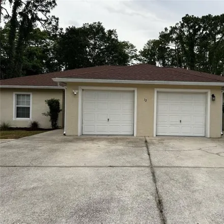 Rent this 3 bed house on 76 Ullynn Place in Palm Coast, FL 32164